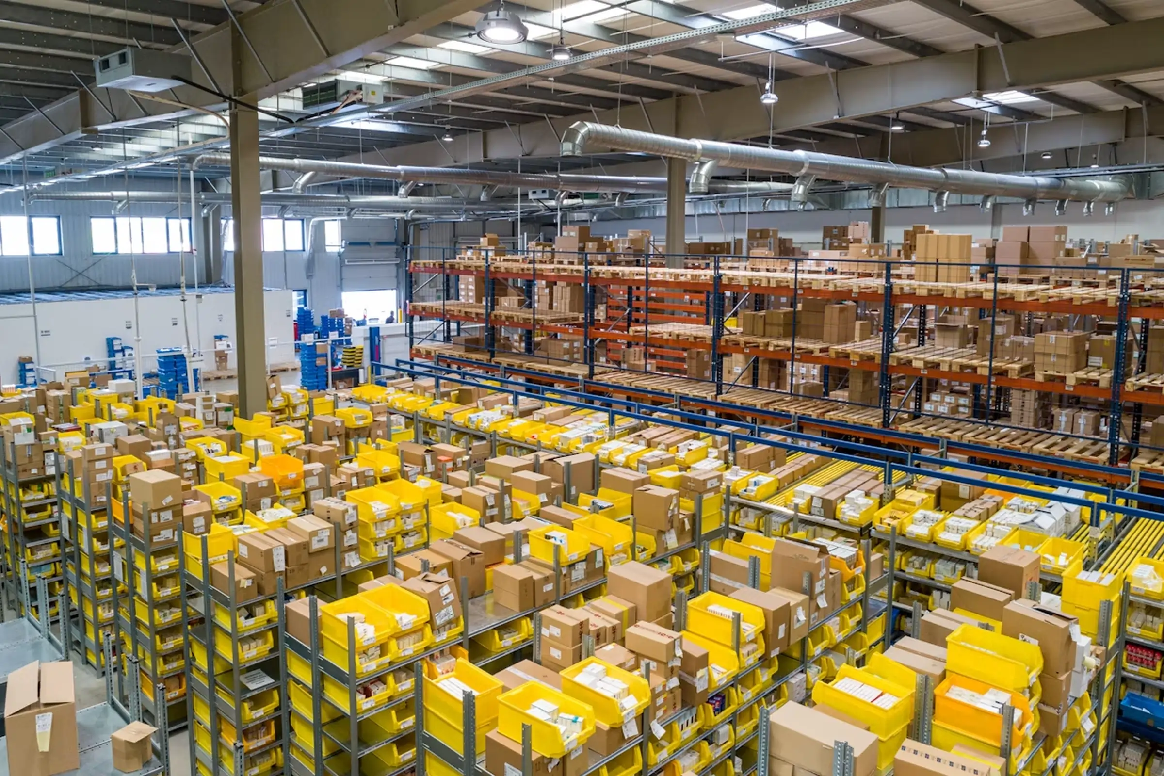 Logistics professionals reviewing supply chain operations in a distribution centre